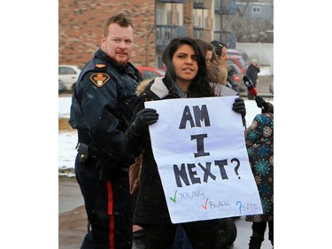 About 60 people gathered in Pleasant Hill Park to rally against the practice of police carding before marching to City Hall, March 15, 2016. Two police service members briefly visited the rally as well.