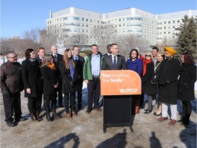 NDP leader Cam Broten stands with some of his diverse group of candidates at a press conference in front of Saskatoon's City Hospital.