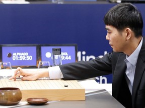 South Korean professional Go player Lee Sedol puts the first stone against Google's artificial intelligence program, AlphaGo during the second match of the Google DeepMind Challenge Match in Seoul, South Korea, Thursday, March 10, 2016. Google's computer program AlphaGo defeated its human opponent, South Korean Go champion Lee Sedol, on Wednesday in the first face-off of a historic five-game match.
