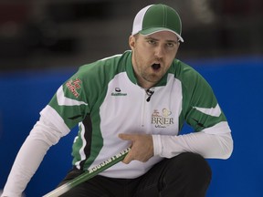 Team Saskatchewan skip Steve Laycock calls to teammates as his shot enters the house during round robin competition against Team PEI at the Brier curling championship, Tuesday, March 8, 2016 in Ottawa.