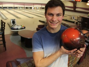 Ten-pin bowler Ace Vandenheuvel, holding his customized bowling ball, rolled a perfect 300 game at Fairhaven Bowl Sunday night.
