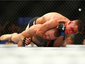 LAS VEGAS, NV - MARCH 5:   Nate Diaz applies a choke hold to win by submission against Conor McGregor during UFC 196 at the MGM Grand Garden Arena on March 5, 2016 in Las Vegas, Nevada.