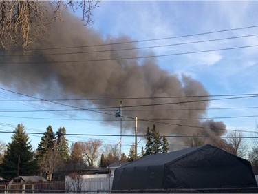 Saskatoon firefighters battle a blaze at an auto salvage yard at Avenue P and 14th Street West in Saskatoon on April 19, 2016.