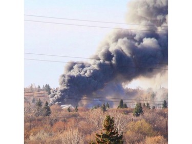 Saskatoon firefighters battle a blaze at an auto salvage yard at Avenue P and 14th Street West in Saskatoon on April 19, 2016.