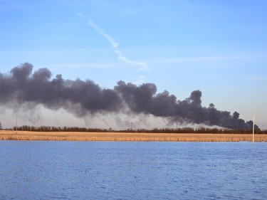 Saskatoon firefighters battle a blaze at an auto salvage yard at Avenue P and 14th Street West in Saskatoon on April 19, 2016.