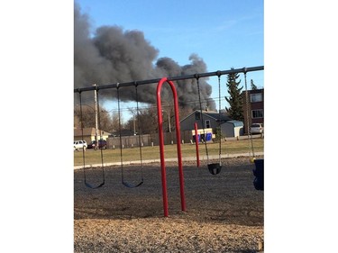 Saskatoon firefighters battle a blaze at an auto salvage yard at Avenue P and 14th Street West in Saskatoon on April 19, 2016.