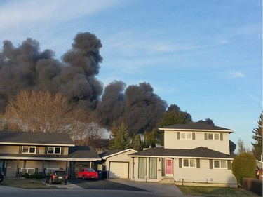 Saskatoon firefighters battle a blaze at an auto salvage yard at Avenue P and 14th Street West in Saskatoon on April 19, 2016.