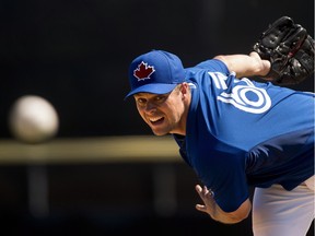 Toronto Blue Jays pitcher Andrew Albers warms up while playing against the Pittsburgh Pirates during eighth inning Grapefruit League baseball action in Dunedin, Fla., on Sunday, March 8, 2015. After a season in South Korea, Canadian pitcher Albers is back on more familiar turf.