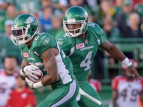 Saskatchewan Roughriders quarterback Darian Durant (4) hands off to running back Anthony Allen (#26) during pre-season CFL action against the Calgary Stampeders in Regina on Friday June 19, 2015. Durant has some good news for Saskatchewan Roughriders fans. The veteran quarterback says he's 95 per cent recovered from the Achilles injury that forced him to miss most of last season.