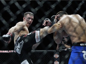 Rory MacDonald, left, kicks Demian Maia during a UFC 170 welterweight fight on Feb. 22, 2014, in Las Vegas