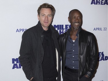 Actor and director Don Cheadle (R) poses with actor Ewan McGregor at the screening of "Miles Ahead" in London, England, April 5, 2016.