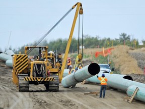 Workers assemble the Enbridge pipeline to Hardisty, Alta., in September 2014.
