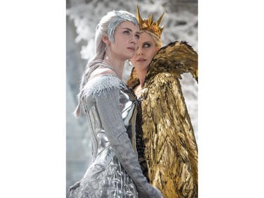 Emily Blunt as Queen Freya and Charlize Theron as Queen Ravenna in "The Huntsman: Winter's War."
