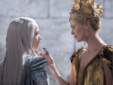 Emily Blunt (L) and Charlize Theron star in "The Huntsman: Winter's War."