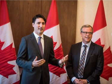 Prime Minister Justin Trudeau (L) addresses the press at a meeting with Saskatchewan Premiere Brad Wall in Saskatoon, April 27, 2016.