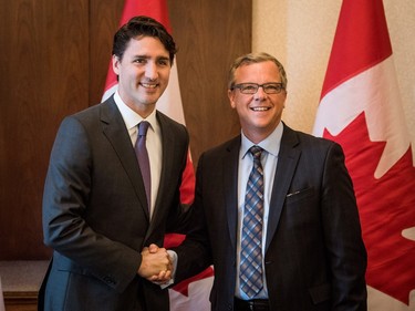 Prime Minister Justin Trudeau (L) addresses the press at a meeting with Saskatchewan Premiere Brad Wall in Saskatoon, April 27, 2016.