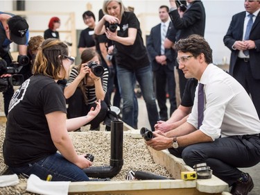 Prime Minister Justin Trudeau talks with Karolyn Doiron during a visit to the YWCA Trade Journey Program at Saskatchewan Polytechnic in Saskatoon, April 27, 2016.