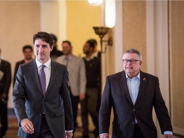 Prime Minister Justin Trudeau (L) prepares to address press with Minister of Public Safety Ralph Goodale after meeting with Saskatchewan Premier Brad Wall in Saskatoon, April 27, 2016.
