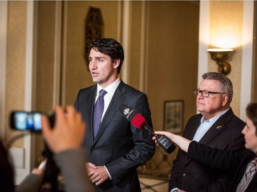 Prime Minister Justin Trudeau (L) addresses press with Minister of Public Safety Ralph Goodale after meeting with Saskatchewan Premier Brad Wall in Saskatoon, April 27, 2016.