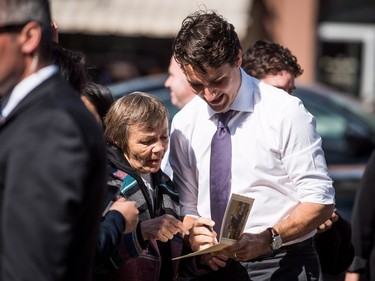 Prime Minister Justin Trudeau greets people on his way to Oskayak High School in Saskatoon, April 27, 2016.