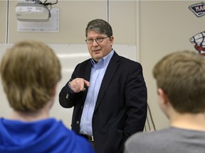 Michael Boda, chief electoral officer for Saskatchewan, speaks to students about his work at Miller Comprehensive High School in Regina on Wednesday Feb. 24, 2016.