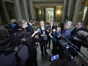 Brad Wall speaks to reporters at the Saskatchewan Legislature the morning after his Saskatchewan Party won its third majority.