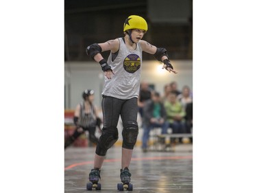 Team White takes on Team Black in a Invitational Scrimmage at the home opener for the Saskatoon Roller Derby League at Archibald Arena on Saturday, April 2nd, 2016.