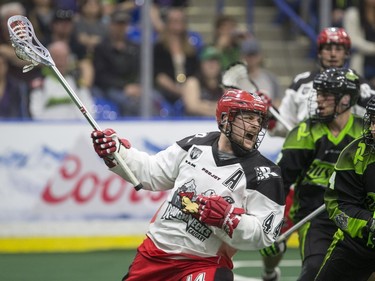 Calgary Roughnecks forward Dane Dobbie moves the ball against the Saskatchewan Rush in NLL action on Saturday, April 2nd, 2016.