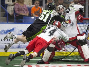 Saskatchewan Rush forward Marty Hinsdale dives to take a shot on the Calgary Roughnecks in NLL action on April 2, 2016.