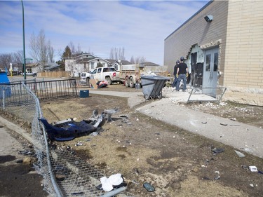 The Saskatoon Police Collision Analyst Unit and workers on the scene of Silverspring School on April 3, 2016. Earlier in the morning a 25-year-old driver went over an embankment and collided with the school.