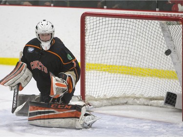 Saskatoon Contacts goalie Isaac LaBelle looks at a puck go off the post from Winnipeg Wild during the Telus Cup West regional tournament final at Rod Hamm Memorial Arena on Sunday, April 3rd, 2016.