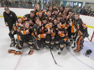 The Saskatoon Contacts celebrate their win over the Winnipeg Wild at the Telus Cup West regional tournament final at Rod Hamm Memorial Arena on April 3, 2016.