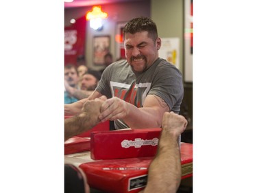 Clayton Turcotte battles during the World Armwrestling League on ESPN's 2016 Super Qualifier tournament at Bugsy's Sports Bar at Lawson Heights Mall on Saturday, April 9th, 2016.