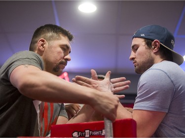 Clayton Turcotte, left, and Darnell Wojocichowski square off during the World Armwrestling League on ESPN's 2016 Super Qualifier tournament at Bugsy's Sports Bar at Lawson Heights Mall on Saturday, April 9th, 2016.