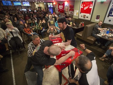 Competitors battle during the World Armwrestling League on ESPN's 2016 Super Qualifier tournament at Bugsy's Sports Bar at Lawson Heights Mall on Saturday, April 9th, 2016.