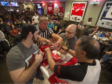 Competitors are strapped in during the World Armwrestling League on ESPN's 2016 Super Qualifier tournament at Bugsy's Sports Bar at Lawson Heights Mall on April 9, 2016.