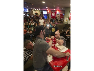 Competitors battle during the World Armwrestling League on ESPN's 2016 Super Qualifier tournament at Bugsy's Sports Bar at Lawson Heights Mall on Saturday, April 9th, 2016.