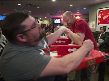 Paul Hickey, right, battles during the World Armwrestling League on ESPN's 2016 Super Qualifier tournament at Bugsy's Sports Bar at Lawson Heights Mall on Saturday, April 9th, 2016.
