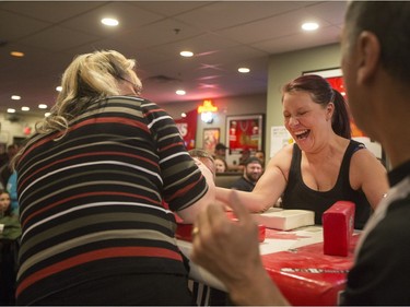Women compete during the World Armwrestling League on ESPN's 2016 Super Qualifier tournament at Bugsy's Sports Bar at Lawson Heights Mall on Saturday, April 9th, 2016