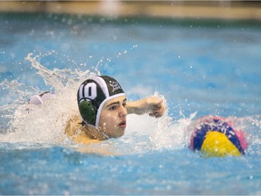 Team Saskatchewan player Stephen Gloade battles for the ball against Team Saanich during the 16U National League Men's and Women's Western Conference water polo championships at the Shaw Centre on Sunday, April 10th, 2016.