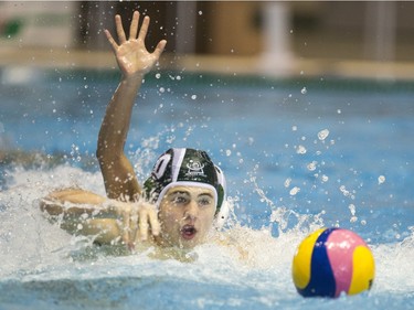 Team Saskatchewan player Stephen Gloade battles for the ball against Team Saanich during the 16U National League Men's and Women's Western Conference  water polo championships at the Shaw Centre on Sunday, April 10th, 2016.