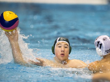 Team Saskatchewan player Calin Chimilar passes the ball against Team Saanich during the 16U National League Men's and Women's Western Conference water polo championships at the Shaw Centre on Sunday, April 10th, 2016.