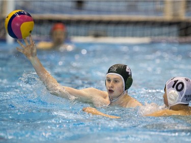 Team Saskatchewan player Josh Techerob passes the ball against Team Saanich during the 16U National League Men's and Women's Western Conference water polo championships at the Shaw Centre on Sunday, April 10th, 2016.