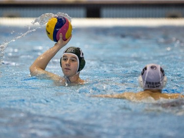 Team Saskatchewan player Calin Chimilar passes the ball against Team Saanich during the 16U National League Men's and Women's Western Conference water polo championships at the Shaw Centre on Sunday, April 10th, 2016.
