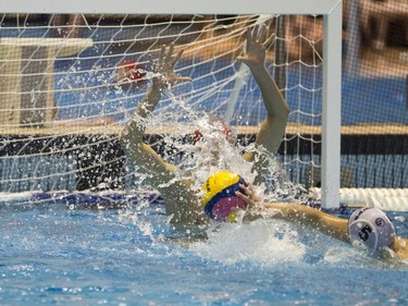 Team Saskatchewan goalie Brody McKnight makes a save against Team Saanich during the 16U National League Men's and Women's Western Conference water polo championships at the Shaw Centre on Sunday, April 10th, 2016.