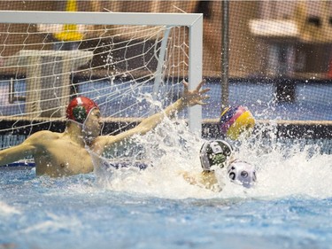 Team Saskatchewan goalie Brody McKnight makes a save against Team Saanich during the 16U National League Men's and Women's Western Conference  water polo championships at the Shaw Centre on Sunday, April 10th, 2016.