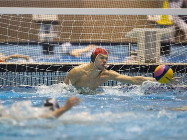 Team Saskatchewan goalie Brody McKnight makes a save against Team Saanich during the 16U National League Men's and Women's Western Conference  water polo championships at Shaw Centre on April 10, 2016.