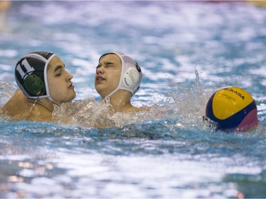 Team Saskatchewan player Malachi Leclere battles for the ball against Team Saanich player Elias Seto during the 16U National League Men's and Women's Western Conference water polo championships at the Shaw Centre on Sunday, April 10th, 2016.
