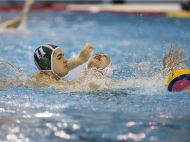 Team Saskatchewan player Malachi Leclere battles for the ball against Team Saanich player Elias Seto during the 16U National League Men's and Women's Western Conference water polo championships at the Shaw Centre on Sunday, April 10th, 2016. (Liam Richards/Saskatoon StarPhoenix)