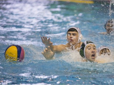 Team Saskatchewan player Ben Guest battles for the ball against Team Saanich during the 16U National League Men's and Women's Western Conference  water polo championships at the Shaw Centre on Sunday, April 10th, 2016.